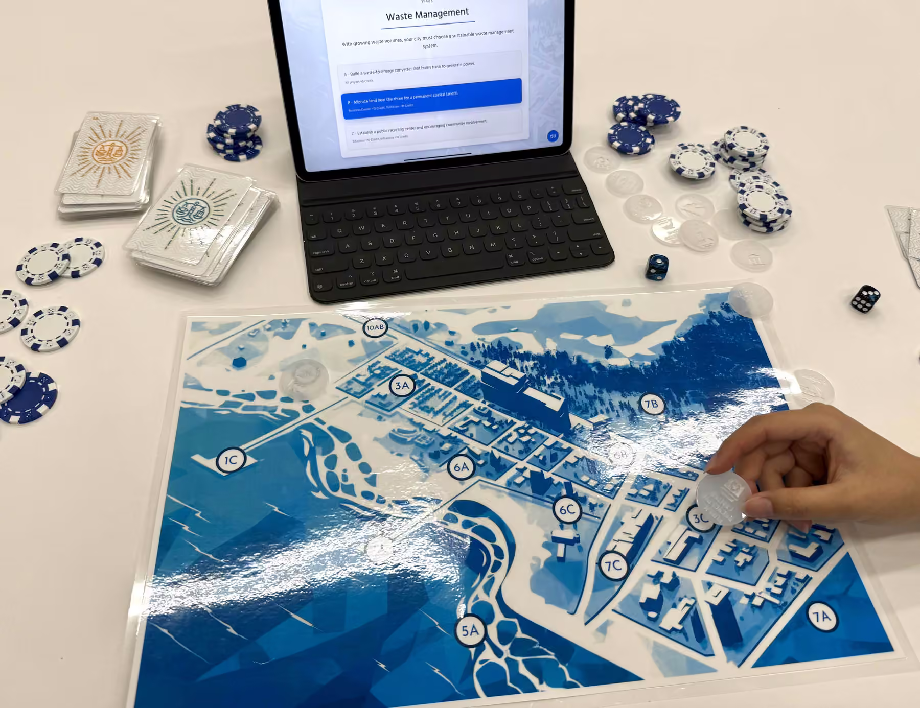A player placing a facility token on the city board beside the tablet companion